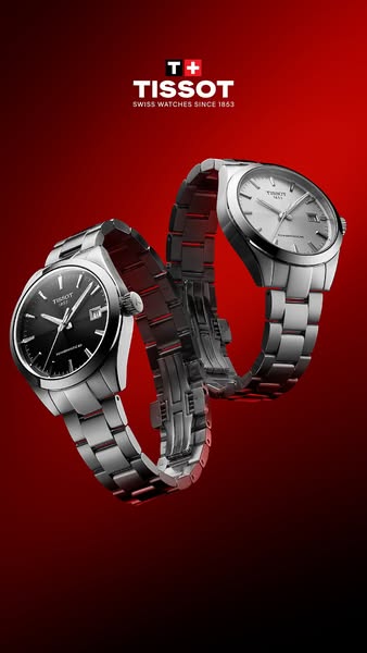 This ad showcases two Tissot watches in a dynamic, elegant composition against a gradient red background, emphasizing th