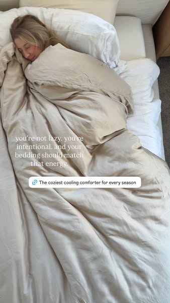 An ad featuring a woman in a bed with white sheets under a tan comforter, emphasizing the idea that intentional rest is 