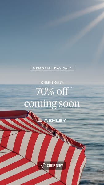 This image ad is for Ashley, promoting a Memorial Day sale with 70% off online only. The ad features an outdoor scene of