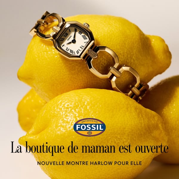 This image ad showcases a Fossil watch positioned on lemons and announces the opening of 'maman's' boutique.