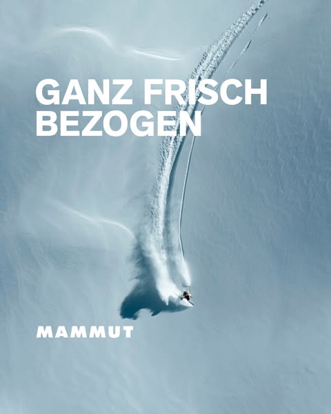 This image ad for Mammut features a skier making fresh tracks in deep powder. The ad uses a minimalist design with a foc
