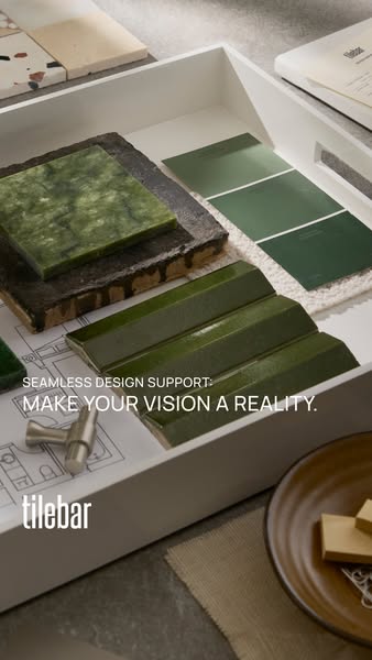 An ad showing a variety of green TileBar tile and paint samples inside of a white tray to promote their design support.