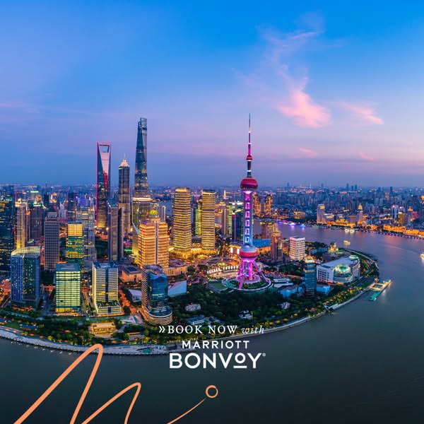 This image ad promotes Marriott Bonvoy, showcasing a scenic view of a city skyline at dusk. The ad aims to entice viewer