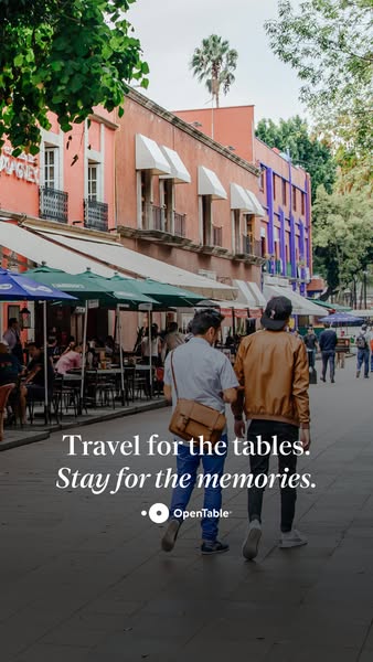 This OpenTable ad features two men walking down a city street lined with restaurants. The ad encourages users to travel 