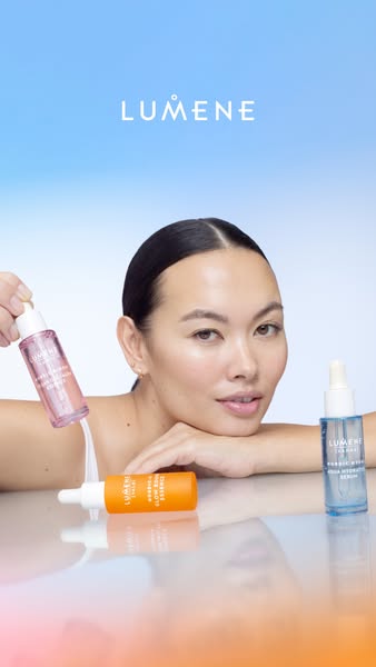 This image ad for Lumene features an Asian woman with clear skin, who is resting her head on her hand as she presents th
