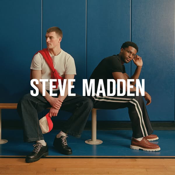 This ad for Steve Madden shows two men sitting on a bench and displaying a range of shoes. The brand name is displayed p
