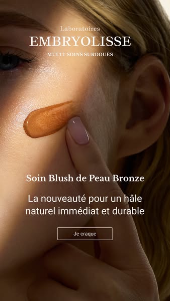 This ad features Embryolisse's bronze blush, demonstrating its application on the face for a natural, sun-kissed glo