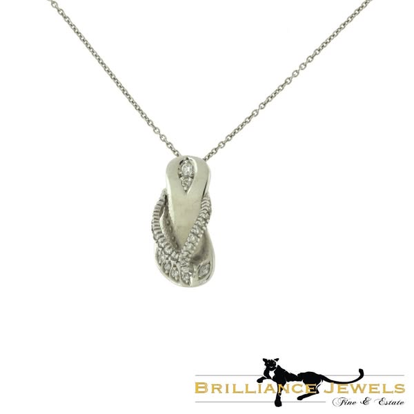 This ad showcases a necklace with a flip flop pendant. The pendant is silver and encrusted with diamonds.
