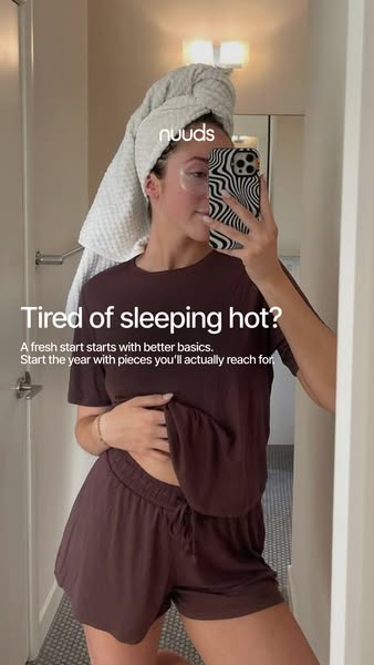 This image ad for Nuuds features a woman in a matching pajama set and a towel wrapped around her head, taking a mirror s