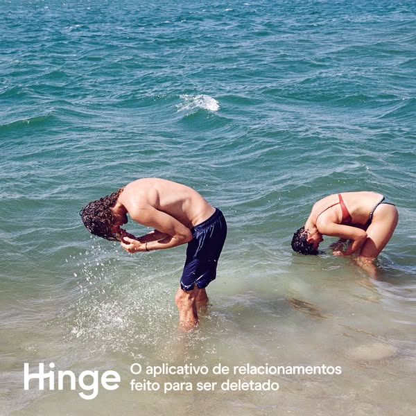 This image ad for Hinge features two people in the ocean with their heads submerged in the water. The ad's tagline i