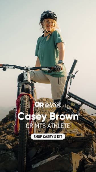 This ad showcases professional MTB athlete Casey Brown wearing Outdoor Research (OR) apparel and gear, highlighting her
