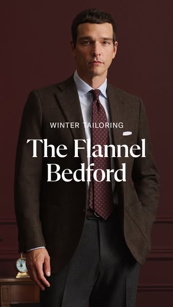 This ad showcases a man wearing a brown flannel suit. The ad highlights the brand's winter tailoring collection, spe