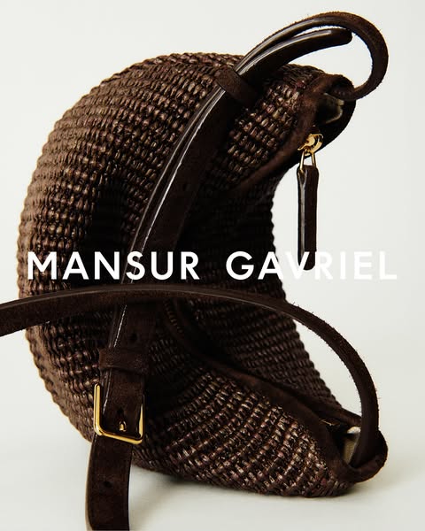This ad features a close-up image of a Mansur Gavriel brown woven handbag with brown leather straps, set against a brigh