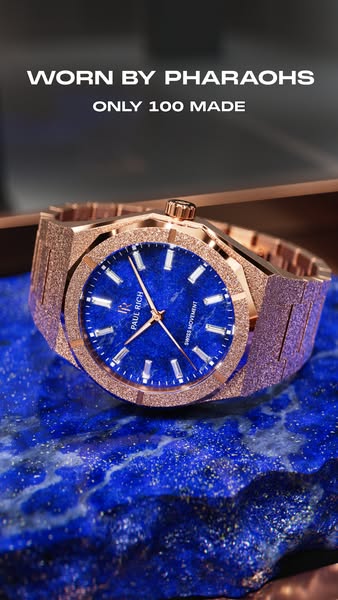 A close-up shot of a Paul Rich watch on a blue marble surface. The headline states that the watch was "WORN BY PHAR