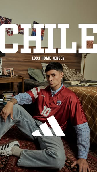 This image showcases the Adidas Chile 1993 Home Jersey with a man modeling it in an indoor setting.