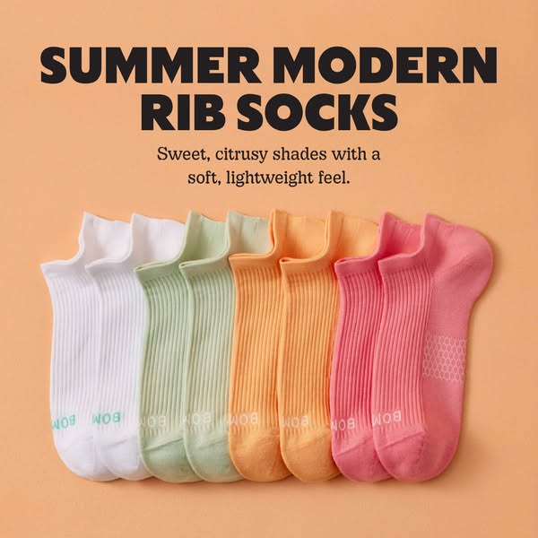 An image ad for Bombas socks featuring a collection of colorful ribbed ankle socks.
