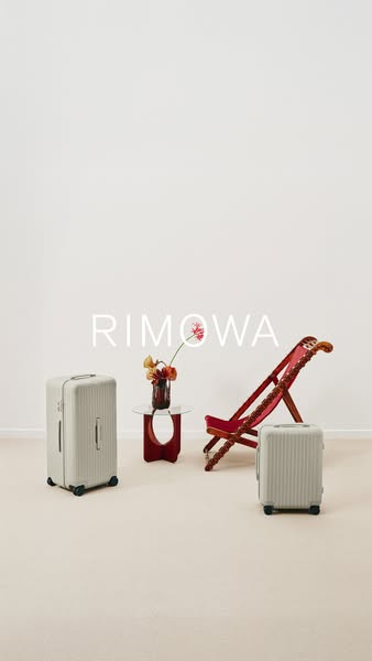 This ad showcases RIMOWA luggage in a lifestyle setting, emphasizing the brand's association with travel and design.