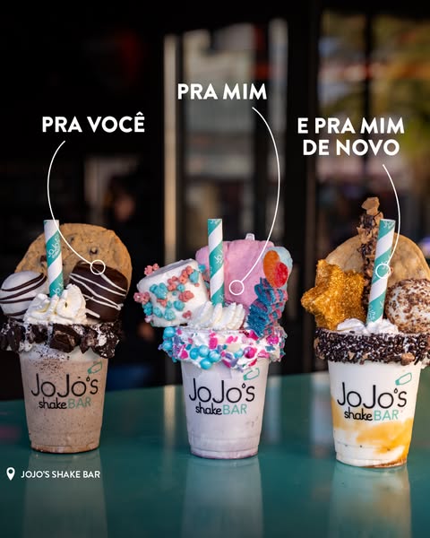 This image ad features three visually distinct milkshakes from JoJo's Shake Bar, each decorated with unique toppings