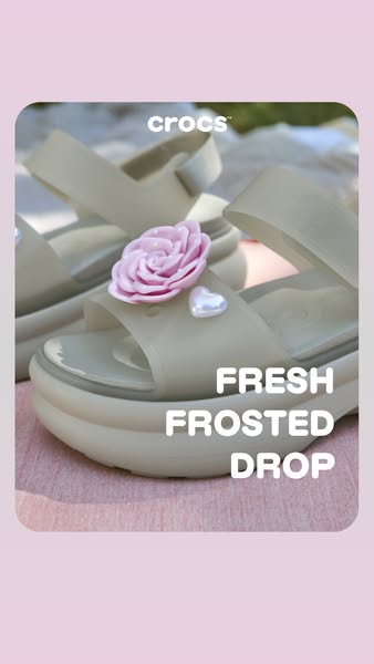 The ad showcases a pair of Crocs sandals with Jibbitz charms, highlighting the brand's latest 'Fresh Frosted Dro