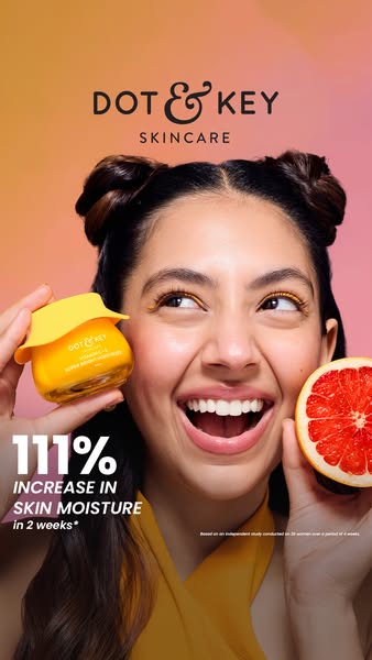 This ad for Dot & Key skincare features a woman holding the Vitamin C+E Super Bright Moisturizer and a grapefruit. T