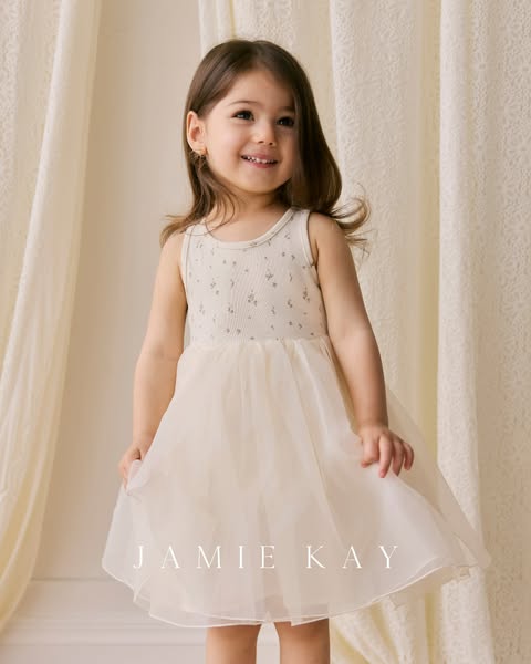 This ad features a young girl wearing a Jamie Kay dress. The ad is likely targeted towards parents or guardians looking 