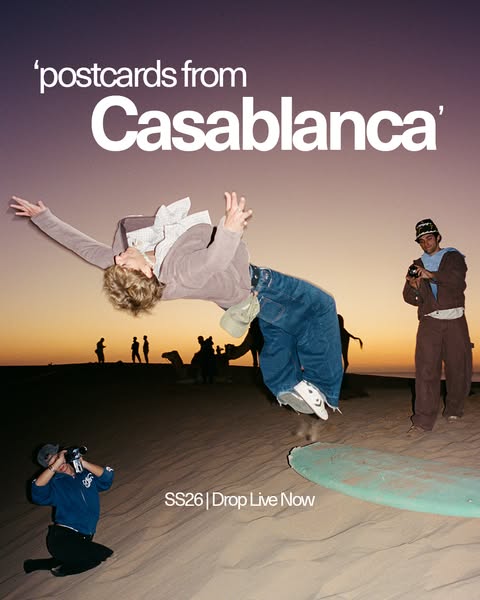 This image ad promotes Casablanca's new collection, featuring people on a sand dune at dusk, one person backflipping