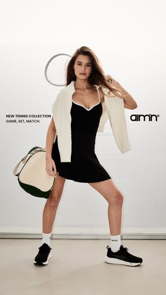 This ad features a model showcasing a black dress and sneakers from the Aimin tennis collection, embodying an active and