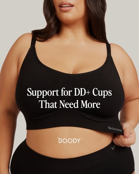 This ad features a model wearing a Boody brand black bra and underwear set, emphasizing the support and comfort for DD+ 