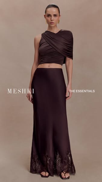 This ad features a woman modeling a top and skirt from MESHKI. The ad calls out the product as being from 'The Essen