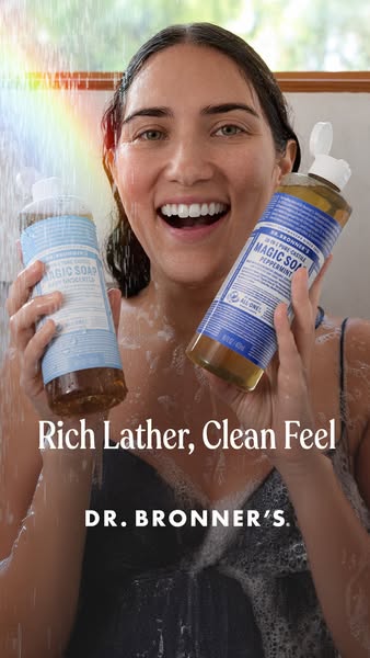 This ad features a woman in the shower holding two bottles of Dr. Bronner's soap. The ad highlights the rich lather 