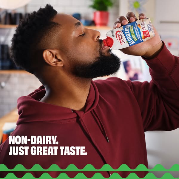 This ad promotes Premier Protein's Amazing Protein shake as a delicious, non-dairy option. A man is shown enjoying t