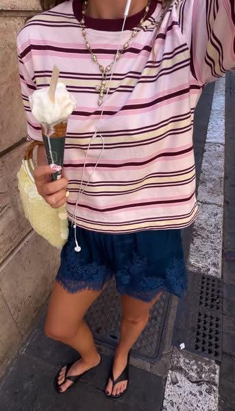 This lifestyle ad features a girl holding an ice cream cone, with the photo cropped from the chest down and angled sligh