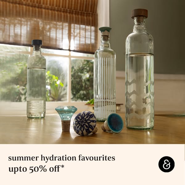This image ad features three glass bottles with unique stoppers, promoting summer hydration favorites with up to 50% off