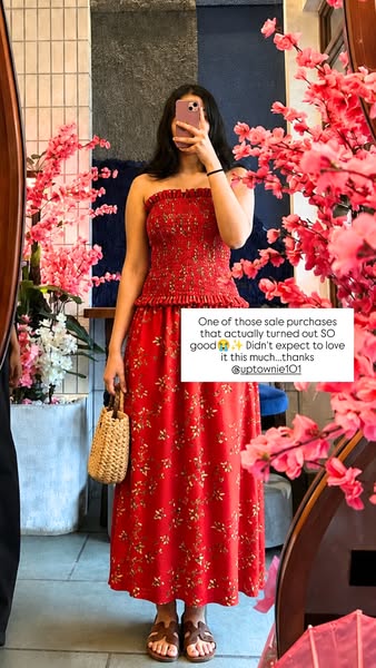 An image ad featuring a woman wearing a red floral dress, with a straw bag and sandals. A testimonial is overlaid on the