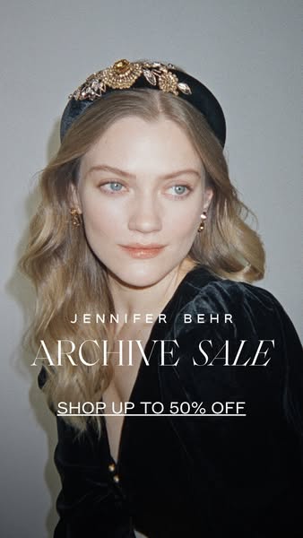 This image ad for Jennifer Behr promotes an archive sale with up to 50% off. It features a model wearing a black velvet 