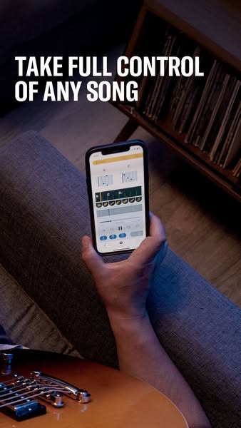 This ad promotes an app that allows users to take full control of any song. The ad features a person holding a phone wit