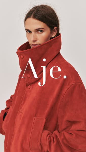 This ad features a woman wearing a red jacket from Aje.