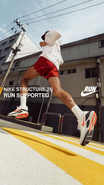 This ad showcases the Nike Structure 26 running shoe, emphasizing its support features. The image features a runner in m