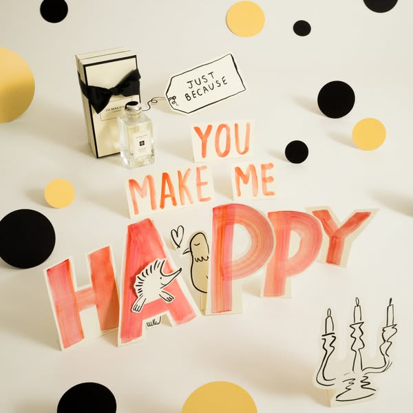 This ad features a Jo Malone fragrance presented as a gift, using playful, hand-drawn elements to convey a sense of joy 