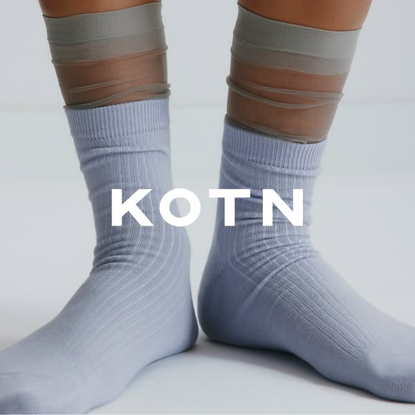This ad features a product showcase of KOTN socks on a model.