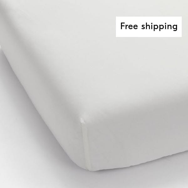 This ad features a close-up of a white fitted sheet on a mattress, promoting free shipping.