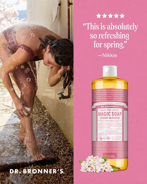 This image ad for Dr. Bronner's Magic Soap features a woman using the Cherry Blossom scent in an outdoor shower, acc