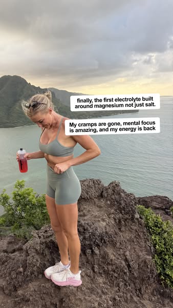 The ad features an active woman on a mountaintop, holding a drink and sharing her personal experience of reduced cramps,