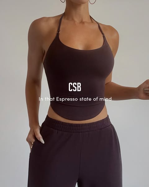 This ad features a woman wearing a matching top and pants set. The ad highlights the color of the set, which is describe