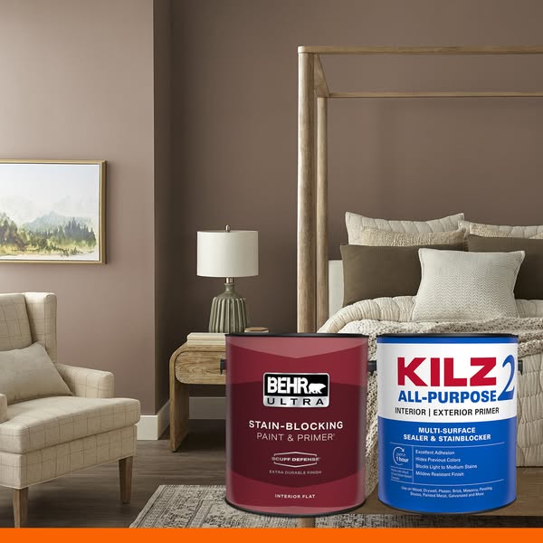 This ad compares two different paint brands. It displays a bedroom with a wall painted brown, with two paint cans in the