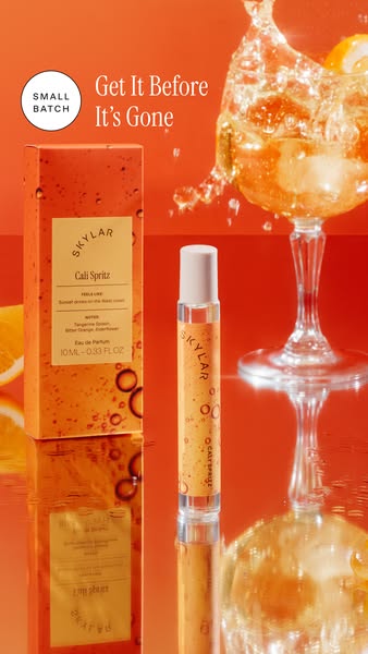 An ad for Skylar's Cali Spritz perfume showing the product and its packaging in front of a blurry image of a cocktai