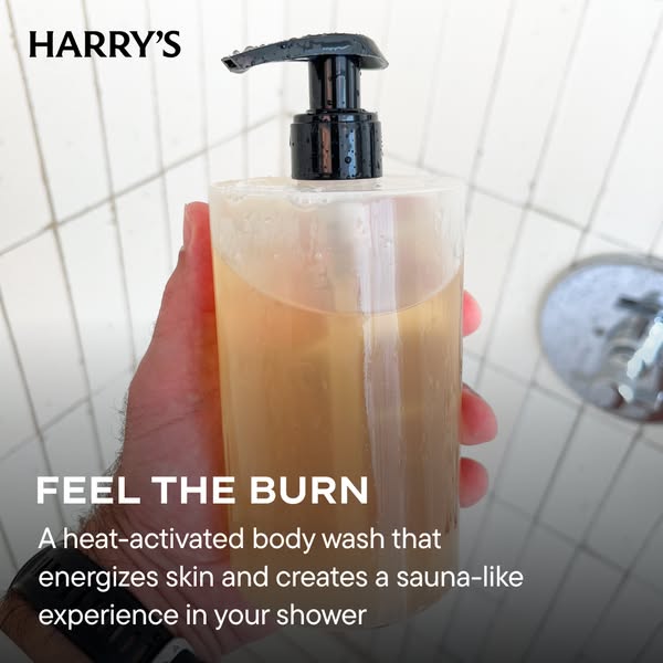 This ad promotes Harry's heat-activated body wash. It showcases the product held by a hand in a shower setting, emph