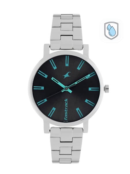 This ad features a close-up product shot of a Fastrack watch with a silver band and a black face with turquoise accents.