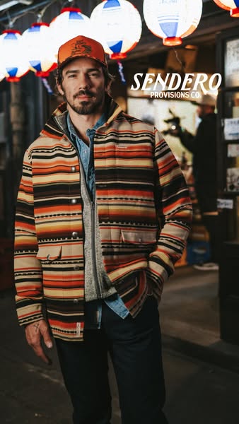 This image ad showcases a man wearing a Sendero Provisions Co. jacket. The ad highlights the brand's name and the ja