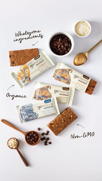 This ad for GoMacro leverages a flatlay of ingredients and packaged bars to create a minimalist, natural presentation. E